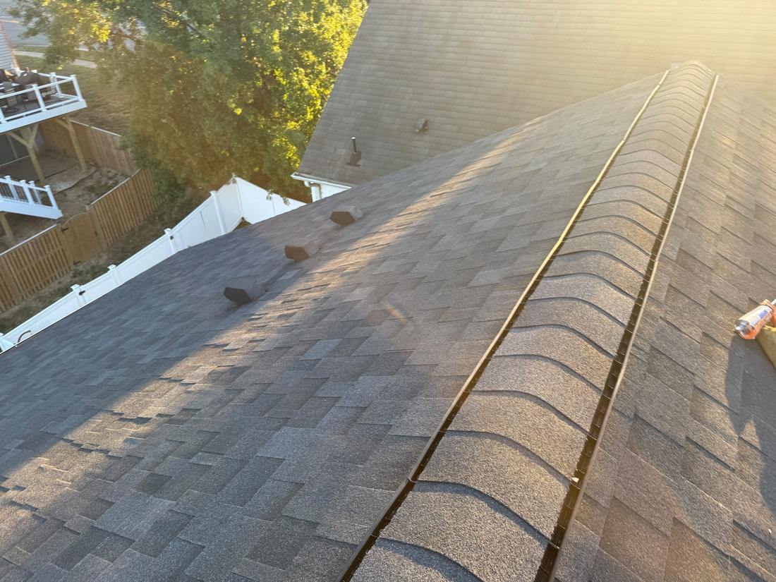 Finished architectural shingle roof with ridge cap